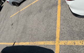 Image of an empty parking space in a parking lot